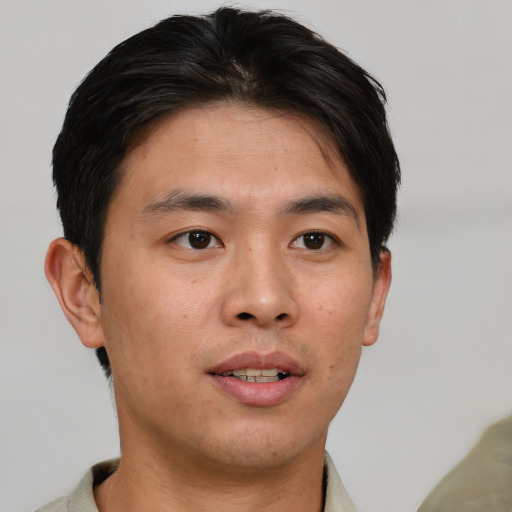 Neutral asian young-adult male with short  brown hair and brown eyes