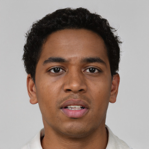 Neutral black young-adult male with short  brown hair and brown eyes