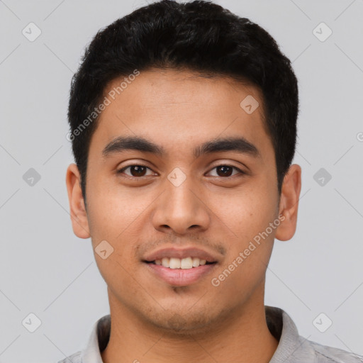 Joyful latino young-adult male with short  black hair and brown eyes