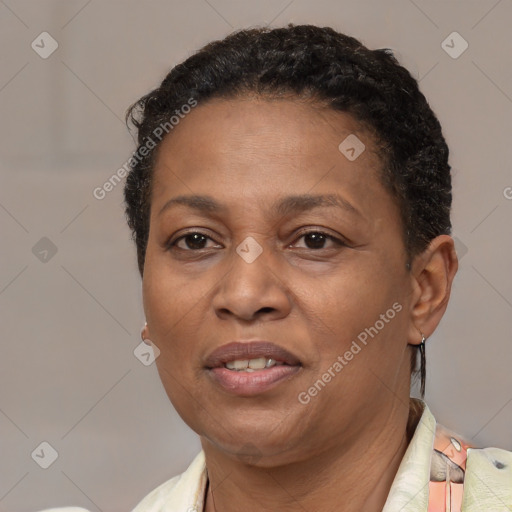 Joyful latino adult female with short  brown hair and brown eyes