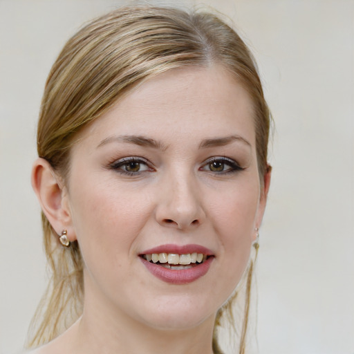 Joyful white young-adult female with medium  brown hair and blue eyes