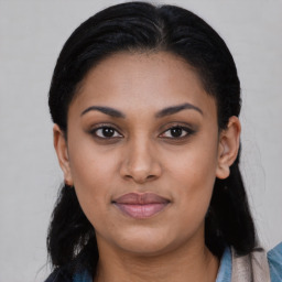 Joyful latino young-adult female with medium  black hair and brown eyes