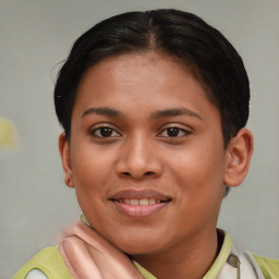 Joyful latino young-adult female with short  brown hair and brown eyes