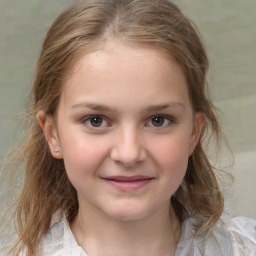 Joyful white child female with medium  brown hair and brown eyes