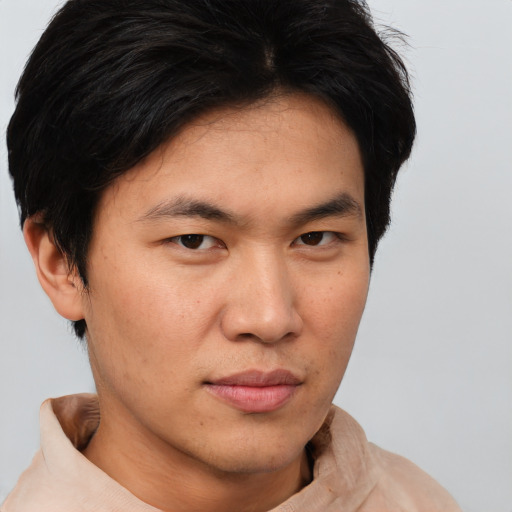 Neutral asian young-adult male with short  brown hair and brown eyes
