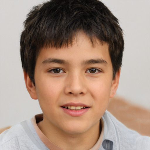 Joyful white child male with short  brown hair and brown eyes