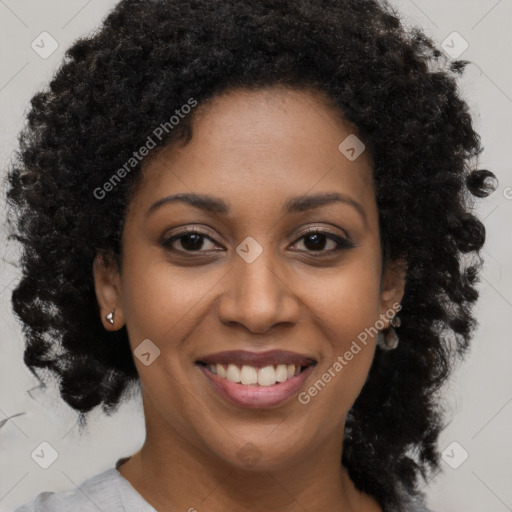 Joyful black young-adult female with long  brown hair and brown eyes