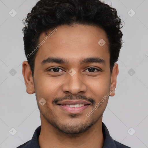 Joyful latino young-adult male with short  brown hair and brown eyes