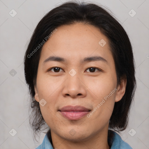 Joyful asian young-adult female with medium  brown hair and brown eyes