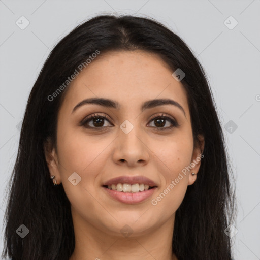 Joyful latino young-adult female with long  brown hair and brown eyes