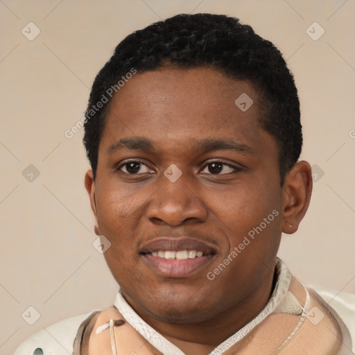 Joyful black young-adult male with short  black hair and brown eyes