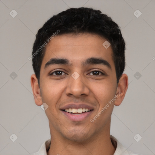 Joyful latino young-adult male with short  black hair and brown eyes