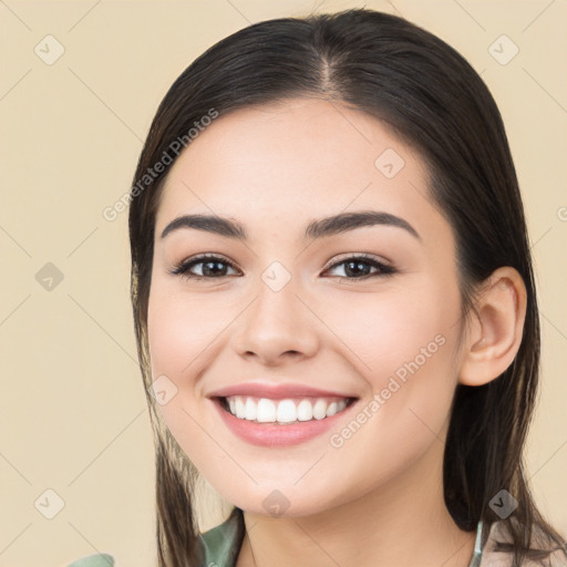 Joyful white young-adult female with long  brown hair and brown eyes