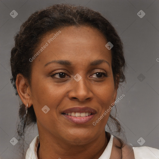 Joyful black adult female with medium  brown hair and brown eyes