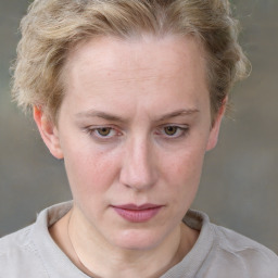 Joyful white adult female with short  brown hair and grey eyes