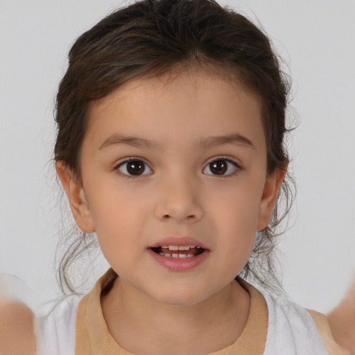 Joyful white child female with medium  brown hair and brown eyes