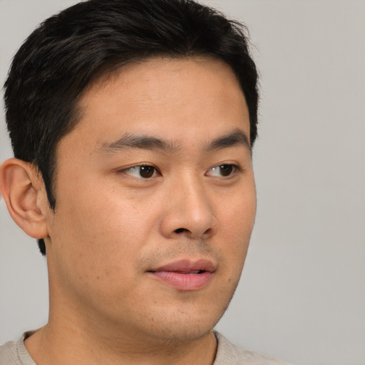 Neutral asian young-adult male with short  brown hair and brown eyes