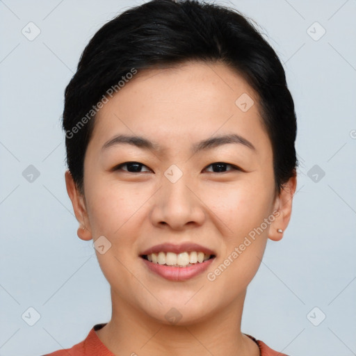 Joyful asian young-adult female with short  brown hair and brown eyes