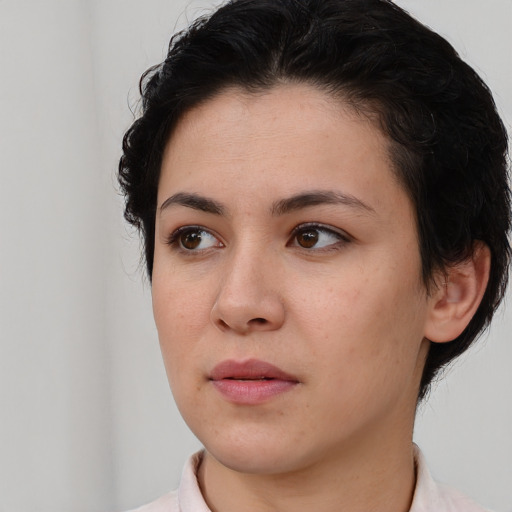 Neutral white young-adult female with short  brown hair and brown eyes