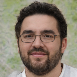 Joyful white adult male with short  brown hair and brown eyes