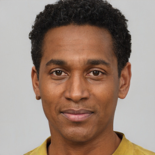 Neutral black young-adult male with short  black hair and brown eyes