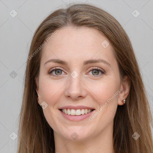 Joyful white young-adult female with long  brown hair and grey eyes