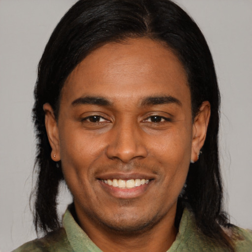 Joyful asian young-adult male with medium  black hair and brown eyes