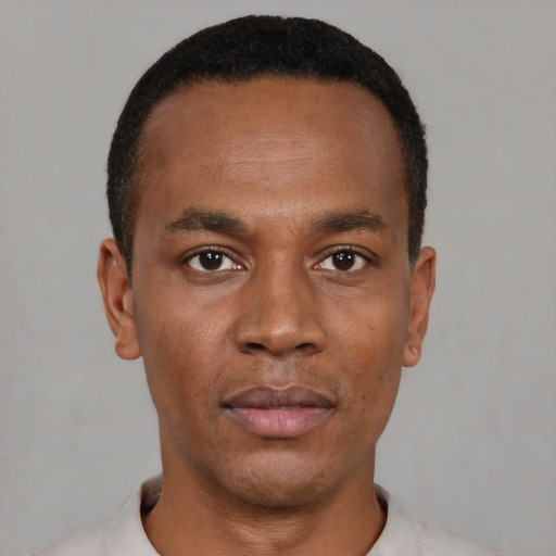 Neutral black young-adult male with short  black hair and brown eyes