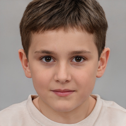 Joyful white child male with short  brown hair and brown eyes