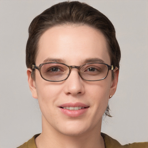 Joyful white young-adult female with short  brown hair and grey eyes