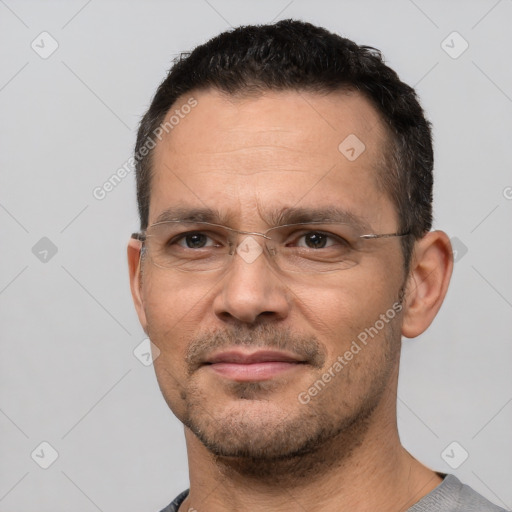 Joyful white adult male with short  brown hair and brown eyes