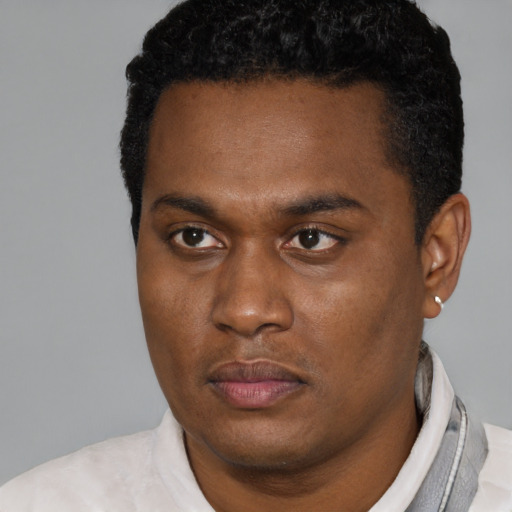 Neutral black young-adult male with short  brown hair and brown eyes