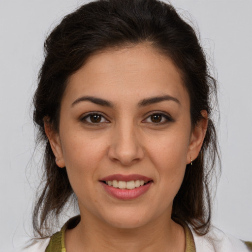 Joyful white young-adult female with medium  brown hair and brown eyes