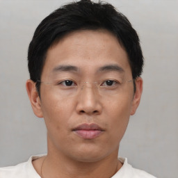 Neutral asian young-adult male with short  brown hair and brown eyes