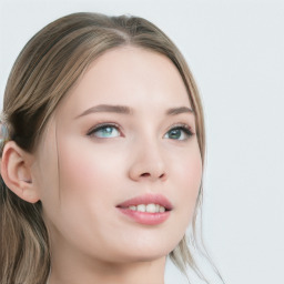 Joyful white young-adult female with long  brown hair and blue eyes