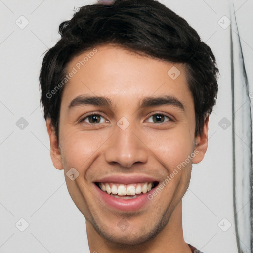 Joyful white young-adult male with short  black hair and brown eyes