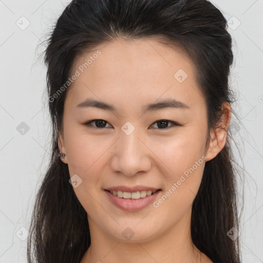 Joyful asian young-adult female with long  brown hair and brown eyes