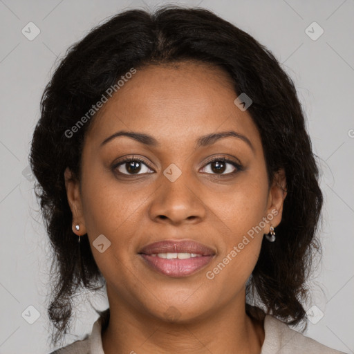 Joyful black adult female with medium  brown hair and brown eyes