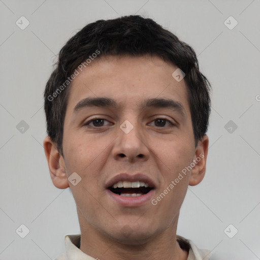 Joyful white young-adult male with short  black hair and brown eyes