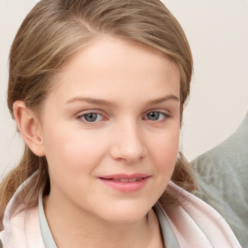 Joyful white child female with medium  brown hair and blue eyes