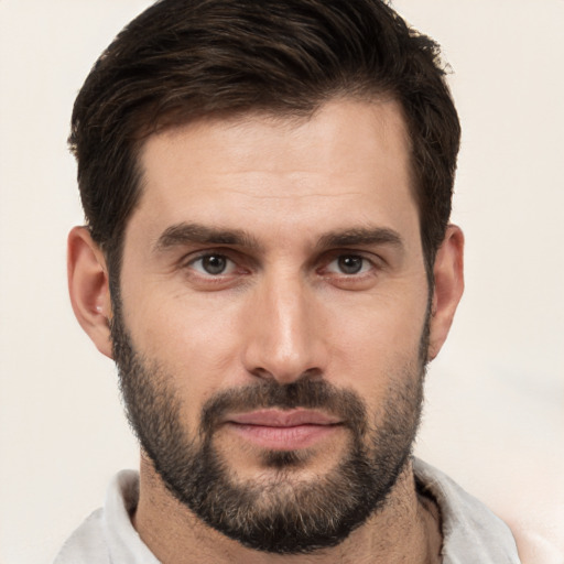 Joyful white young-adult male with short  brown hair and brown eyes