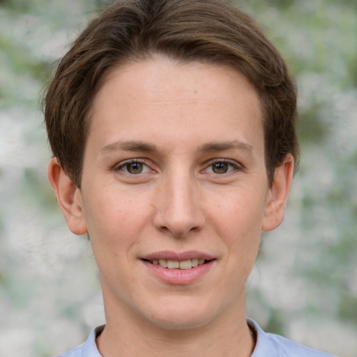 Joyful white young-adult female with short  brown hair and grey eyes