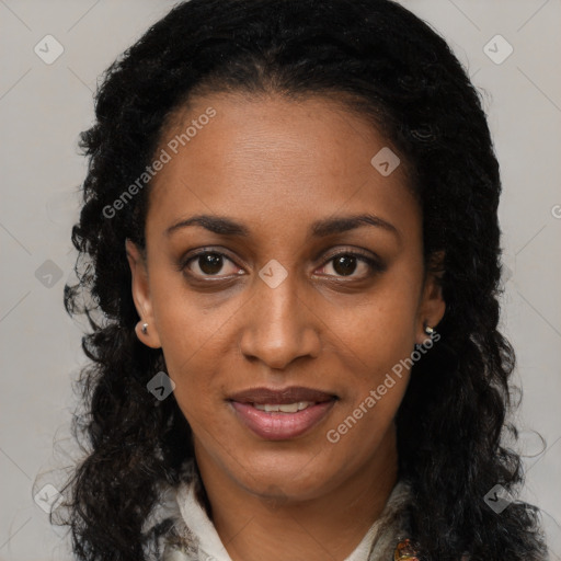 Joyful black young-adult female with long  brown hair and brown eyes