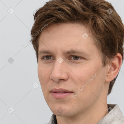 Joyful white adult male with short  brown hair and grey eyes