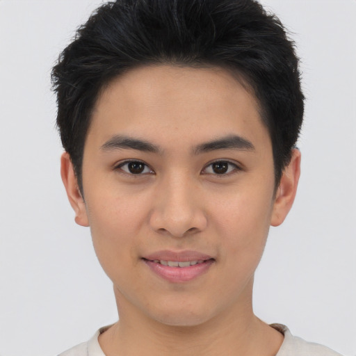 Joyful asian young-adult male with short  brown hair and brown eyes