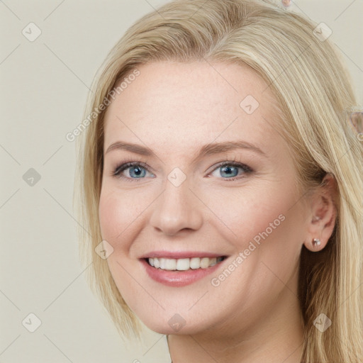 Joyful white young-adult female with long  brown hair and blue eyes