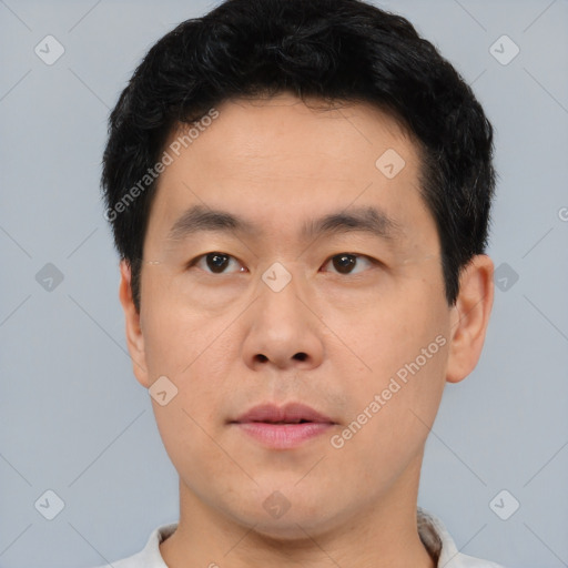 Neutral asian young-adult male with short  black hair and brown eyes