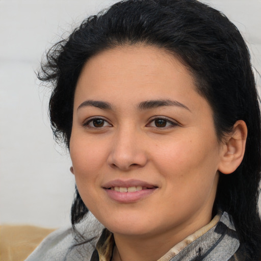 Joyful latino young-adult female with medium  black hair and brown eyes
