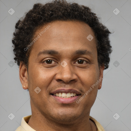 Joyful black young-adult male with short  brown hair and brown eyes
