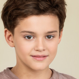 Joyful white child male with short  brown hair and brown eyes